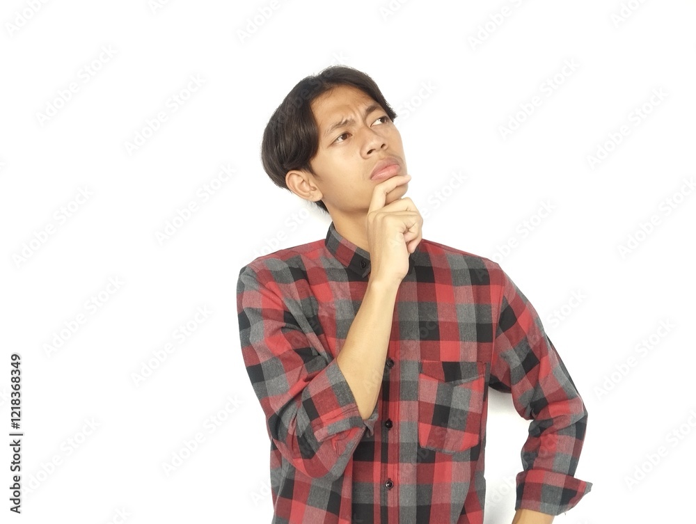 Young Asian man is thinking with eyes looking up, thinking, imagining,
Young Asian man is thinking with eyes looking up, thinking, imagining,