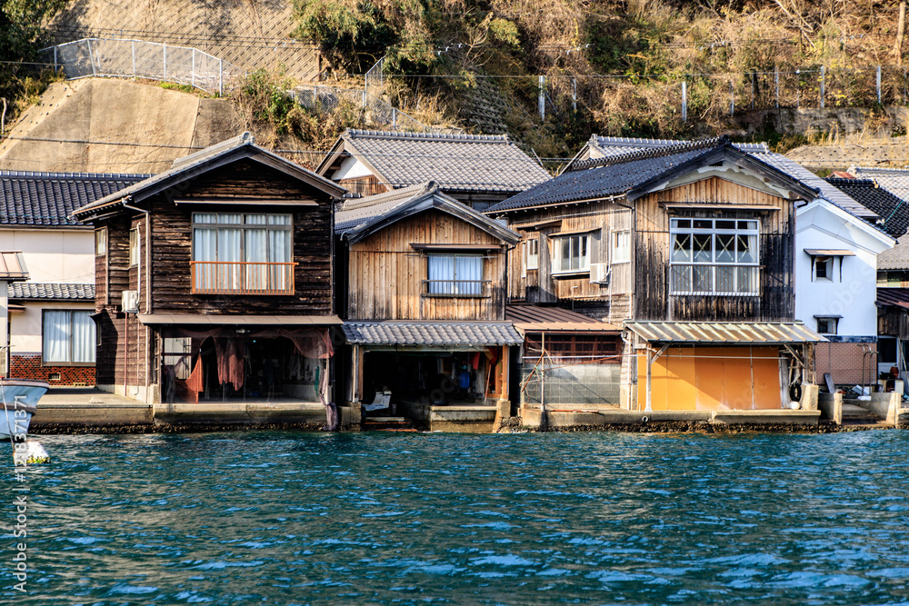 Traditional Japanese Boat Houses Along the Waterfront of Ine Bay, Kyoto, Japan Traditional Japanese Boat Houses Along the Waterfront of Ine Bay, Kyoto, Japan