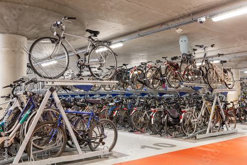 Fototapeta Naklejka Na Ścianę i Meble -  Bicycle parking. Garage for bicycles. Two-level parking for bicycles.