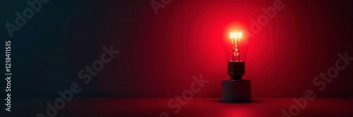 Glow of the red light bulb in a dark environment, illumination, radiance, warmglow photo