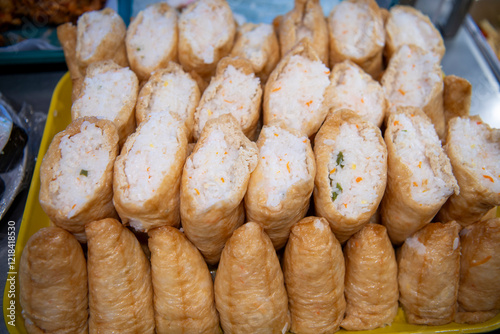 Inari sushi in display case at okazuya Japanese deli