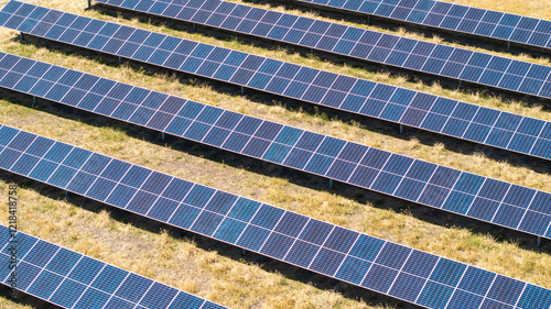 Aerial view of solar array farm on dry grass in Central California