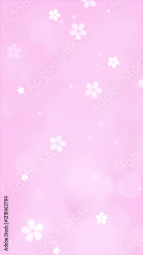 桜の花びらが舞う春の風景。入学式や卒業式にぴったりのピンクのキラキラ輝く背景素材。