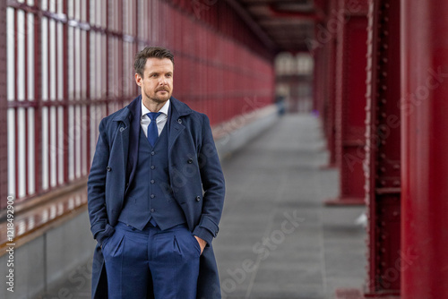 Dapper Gentleman Standing Confidently in a Sophisticated Walkway photo