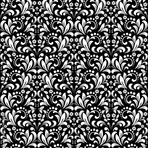 Wallpaper in the style of Baroque. Seamless vector background. White and black floral ornament. Graphic pattern for fabric, wallpaper, packaging. Ornate Damask flower ornament.