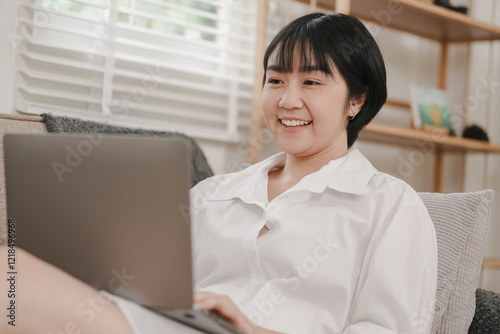Free Download Remote work happiness woman smiling with laptop at home indoor setting positive vibes personal space - GFXLoad