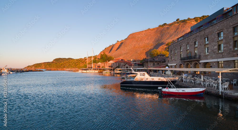 Fototapeta premium The ancient harbour of Behramkale. Turkey's beautiful touristic coast on the North Aegean Sea. Assos shore. Canakkale city, Turkey country