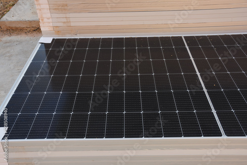 installation of solar panels with a close-up view of the photovoltaic cells arranged in a grid. Each panel is designed to convert sunlight into electricity.