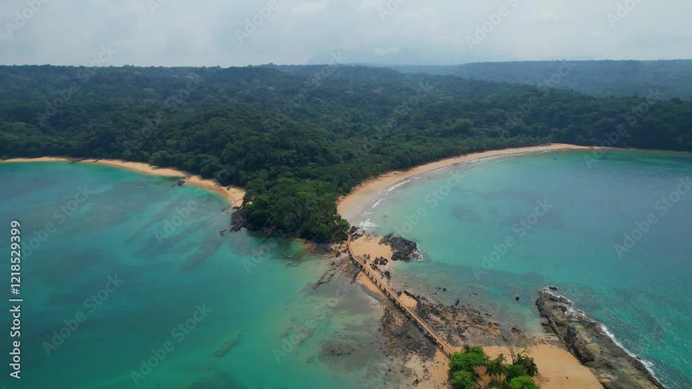 Aerial view from Bom Bom beach and lowering the camera revealing the walkway that connects the beach at bom bom islet at Ilha do Principe, São Tomé,Africa Aerial view from Bom Bom beach and lowering the camera revealing the walkway that connects the beach at bom bom islet at Ilha do Principe, São Tomé,Africa