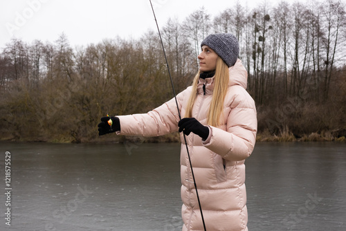 Obraz na plátně Woman fishing on the river