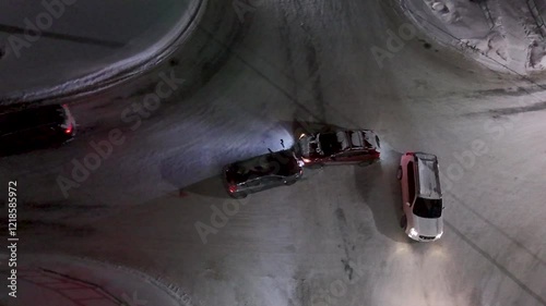 Road accident at night at an intersection in winter. View from above.