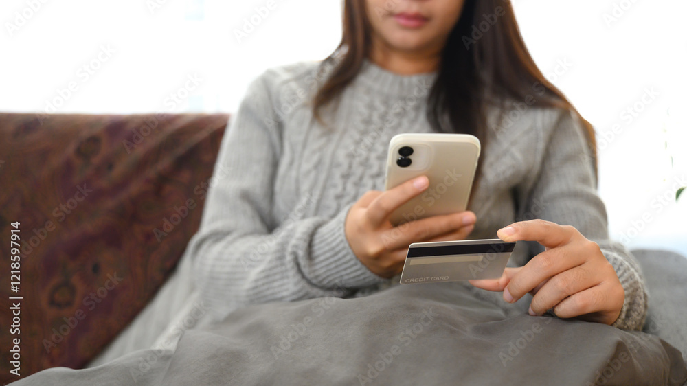 Young woman using mobile phone and credit card. Mobile payments and digital transactions concept Young woman using mobile phone and credit card. Mobile payments and digital transactions concept