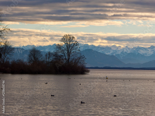 die Roseninsel im Starnberger See mit den verschneiten Alpen im Hintergrund photo