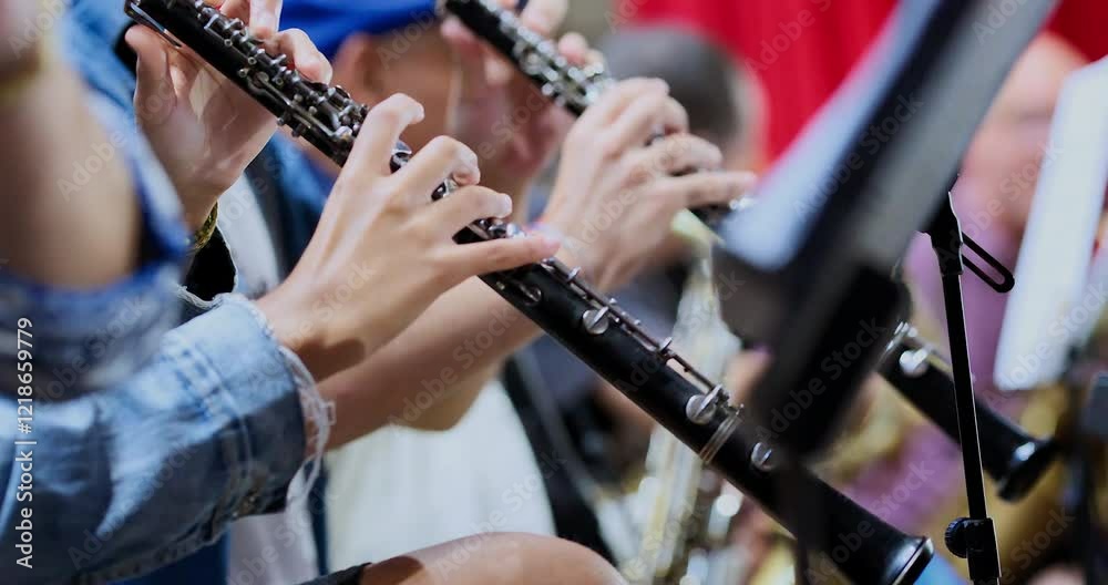 hands playing musical instrument clarinet, selective focus, detail shot, hands only, hands only sin título