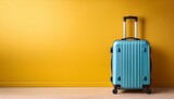 vibrant luggage stands against a bright yellow wall perfect for travel vacation or adventure