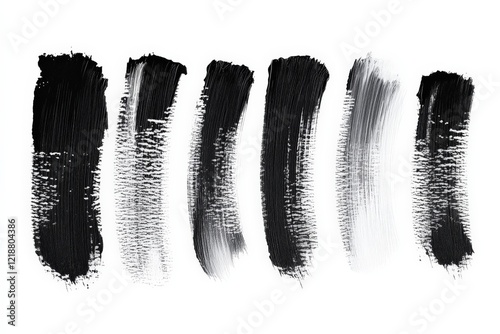 Brush strokes creating various textures in black and white on a blank canvas photo