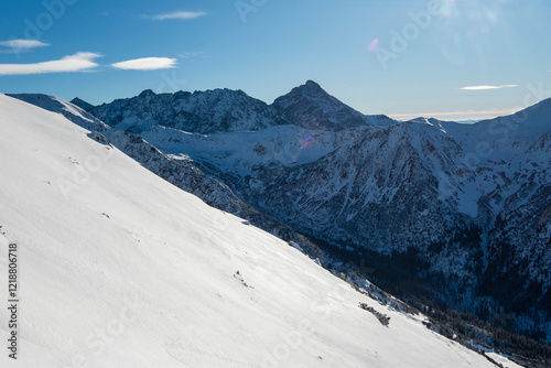 Fototapeta Naklejka Na Ścianę i Meble -  Tatra mountains at winter time. View of the white snow-capped peaks, frosty winter mountains. Kasprowy Wierch, High Tatra, Poland, Europe.