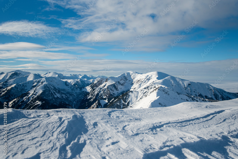 Tatra mountains at winter time. View of the white snow-capped peaks, frosty winter mountains. Kasprowy Wierch, High Tatra, Poland, Europe. Tatra mountains at winter time. View of the white snow-capped peaks, frosty winter mountains. Kasprowy Wierch, High Tatra, Poland, Europe.
