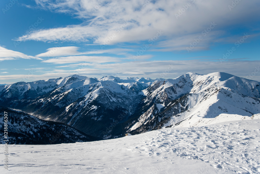 Tatra mountains at winter time. View of the white snow-capped peaks, frosty winter mountains. Kasprowy Wierch, High Tatra, Poland, Europe. Tatra mountains at winter time. View of the white snow-capped peaks, frosty winter mountains. Kasprowy Wierch, High Tatra, Poland, Europe.