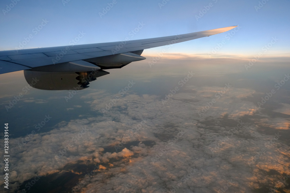 Boeing 747-800 wing and engine in the cruise, at altitude, dawn Boeing 747-800 wing and engine in the cruise, at altitude, dawn