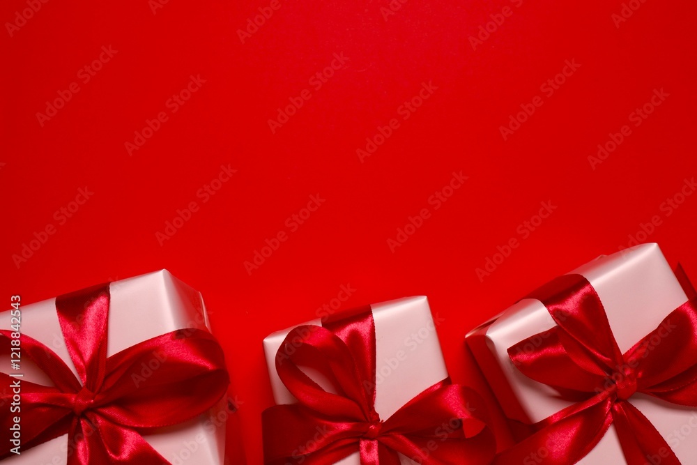 Beautiful gift boxes on red background Beautiful gift boxes on red background