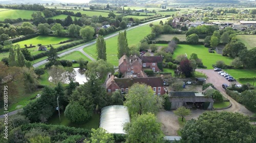 luxurious country house mansion england architecture grounds highlight elegance real estate circling backward aerial drone shot luxury property uk scenic view investment unique  photo