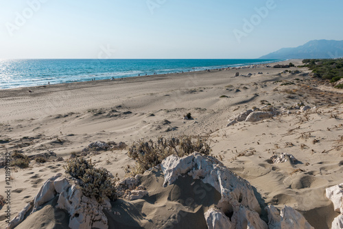 Fototapeta Naklejka Na Ścianę i Meble -  Mediterranean seacoast at the Patara beach on a sunny day with blue sea Antalya region, Turkey.