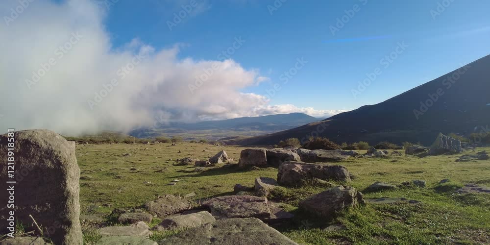 Timelapse of Clouds and Icy Mountain in Cuenca Proaño, Castilla-La Mancha - Timelapse capturing dynamic clouds over a snow-covered mountain in Cuenca Proaño, Castilla-La Mancha.