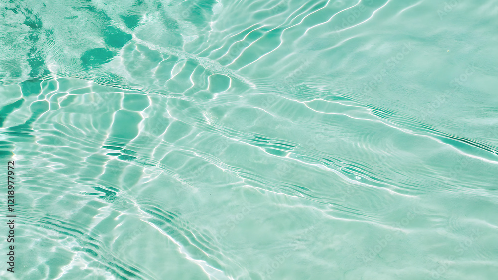 Top view of mint green water. The waves and ripples create an abstract pattern Top view of mint green water. The waves and ripples create an abstract pattern