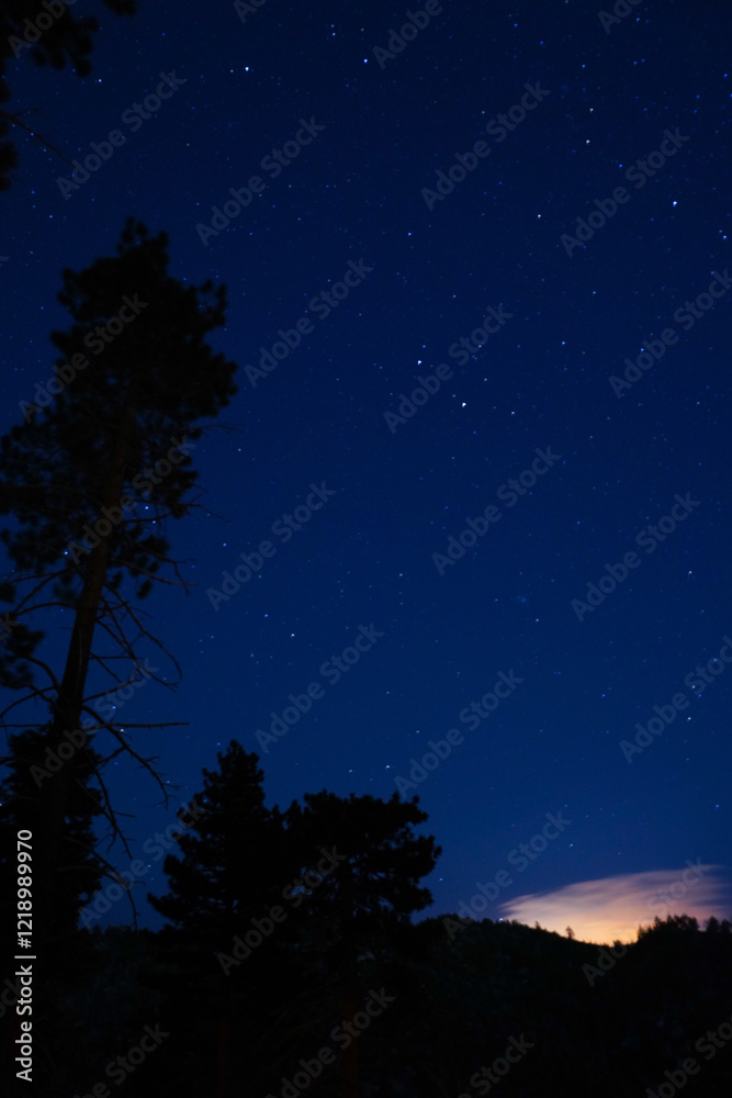Starry Night Sky Over Mountain Landscape with Glowing Horizon and Snow-Capped Peaks Starry Night Sky Over Mountain Landscape with Glowing Horizon and Snow-Capped Peaks