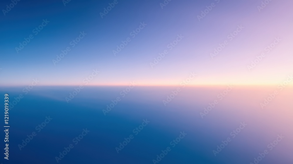 Obraz premium A breathtaking gradient sky transitions from deep blue to soft pink at the horizon, creating a serene and tranquil atmosphere.