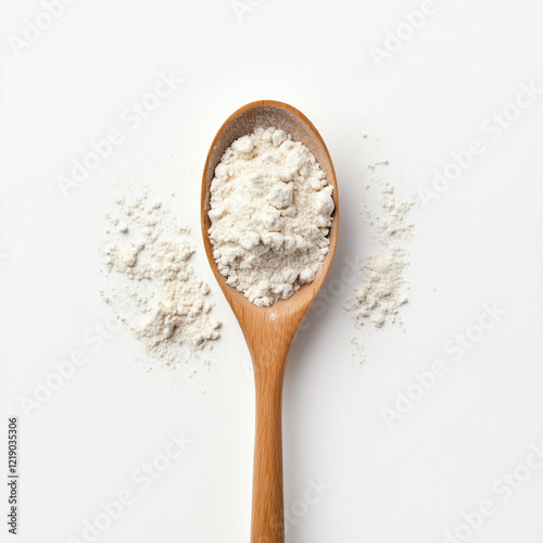 Top view of a wooden spoon with white flour