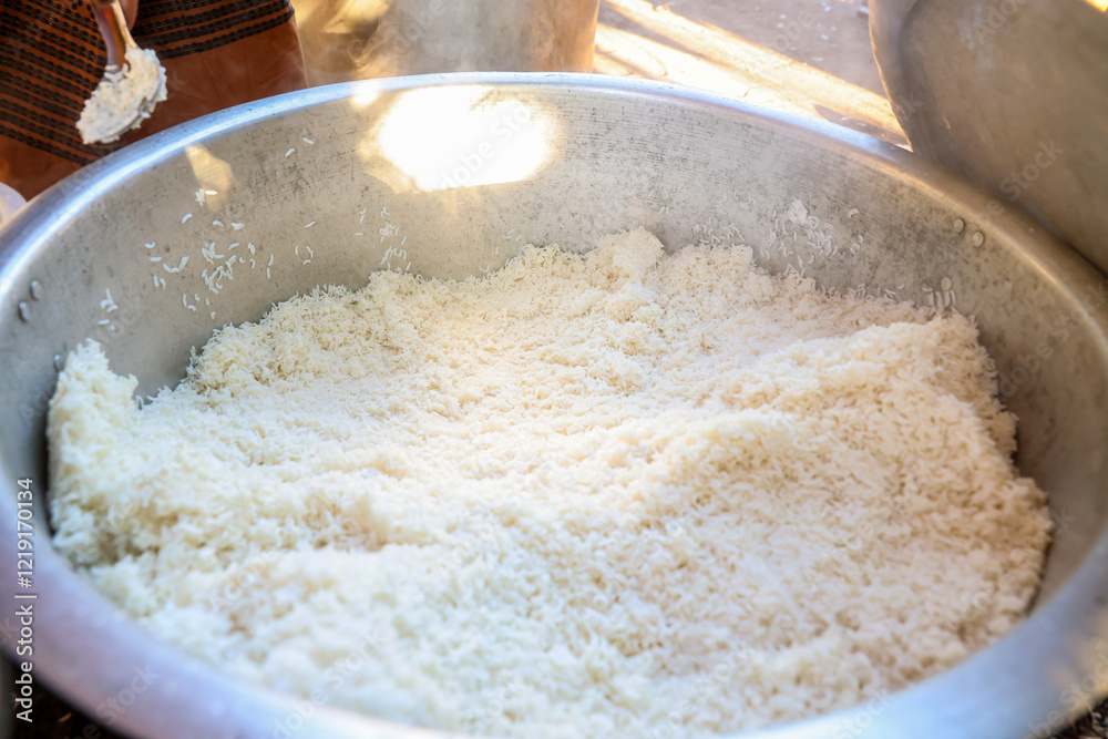 Rice is served in a large pot at a religious ceremony in Myanmar, which is Burmese rice food. Rice is served in a large pot at a religious ceremony in Myanmar, which is Burmese rice food.