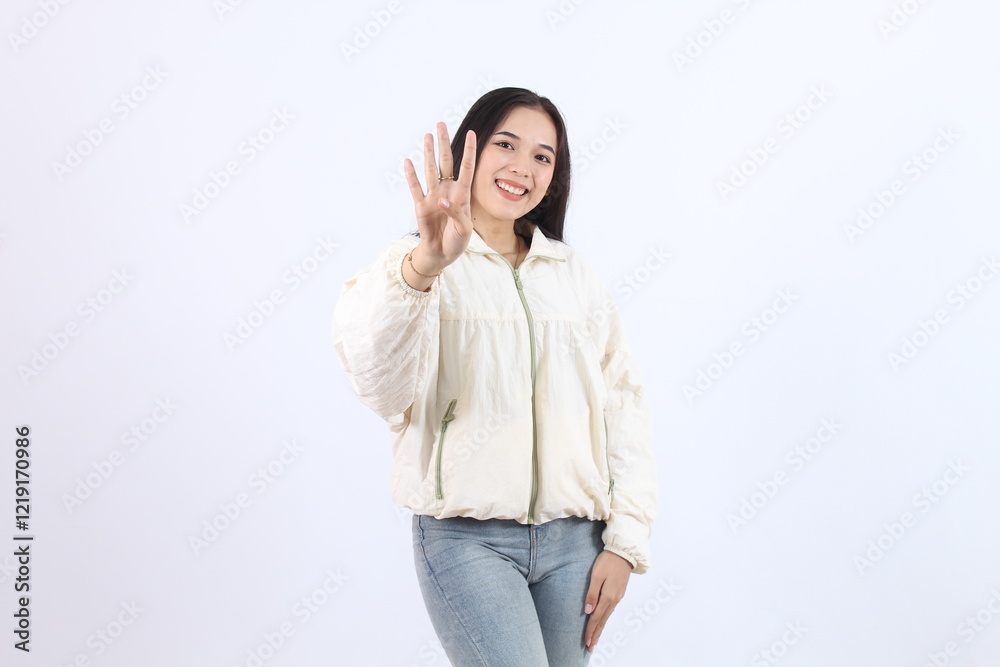 Smiling Adult Asian Woman Showing Peace Gesture in Casual Outfit showing number 4 (four) with finger Smiling Adult Asian Woman Showing Peace Gesture in Casual Outfit showing number 4 (four) with finger