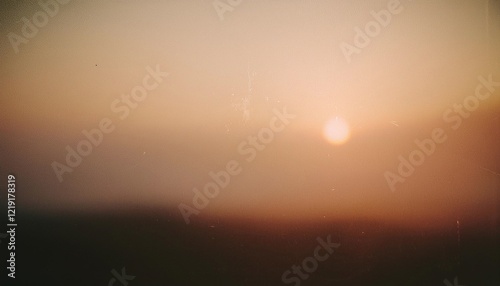 Vintage distressed abstract old photo of foggy sunrise, film grain, dust and scratches texture effect