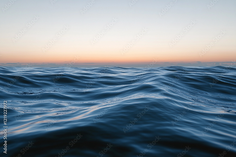 Sunset over calm ocean waters creates a serene atmosphere with vibrant colors on the horizon Sunset over calm ocean waters creates a serene atmosphere with vibrant colors on the horizon