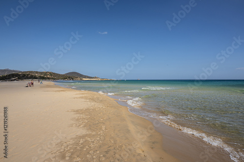 Fototapeta Naklejka Na Ścianę i Meble -  The beautiful beach of Su Giudeu in the south of Sardinia with transparent and turquoise water and a small island in front of the bay