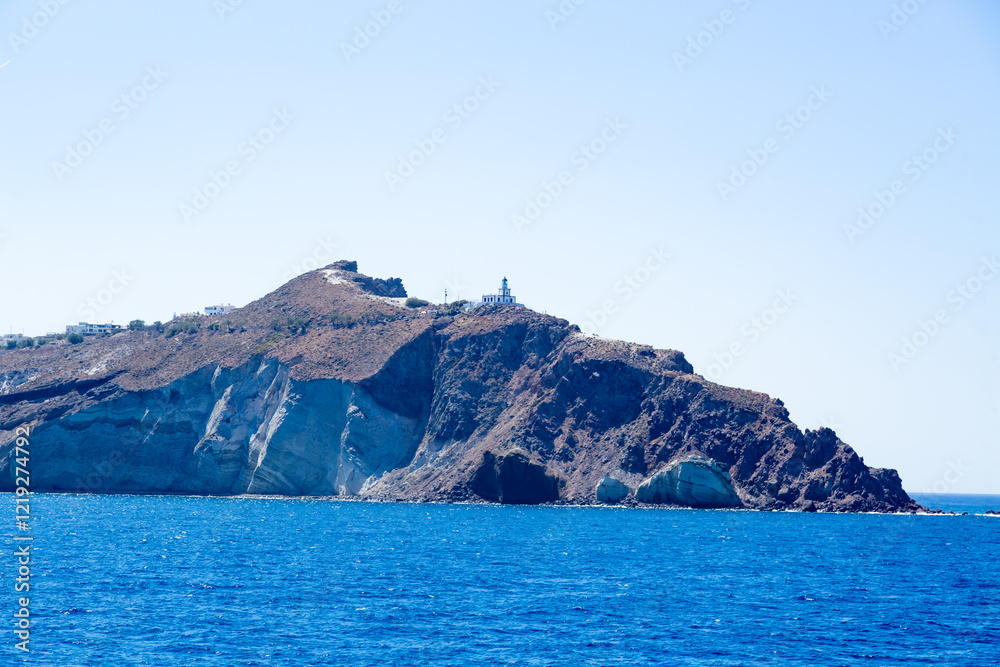 Akrotiri lighthouse on Santorini island from the ferry,Greece