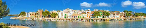 Panorama of Portocolom's old town with quayside and typical boathouses
