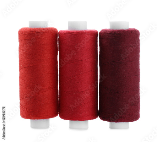 Spools of colorful sewing threads isolated on white