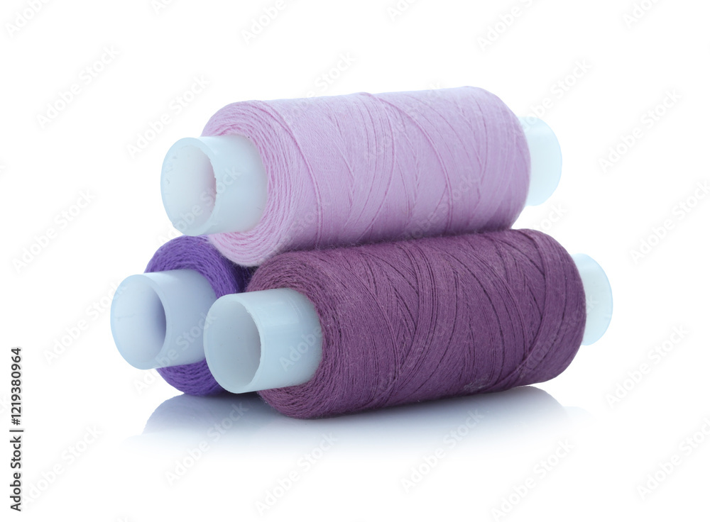 Spools of bright sewing threads isolated on white Spools of bright sewing threads isolated on white