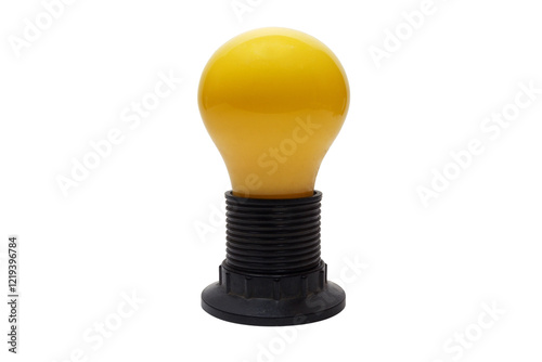 incandescent yellow colored glass Christmas bulb screwed in medium size black plastic lampholder with shade ring on end of threaded shell. isolated on white background photo