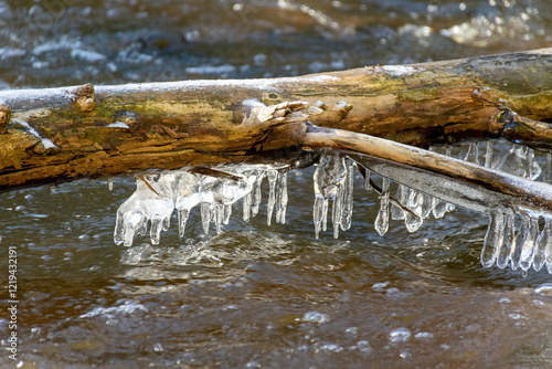 ice formations in a wild river, beautiful frozen ice formations from the interaction of water, flow and frost, Raunis, Latvia photo