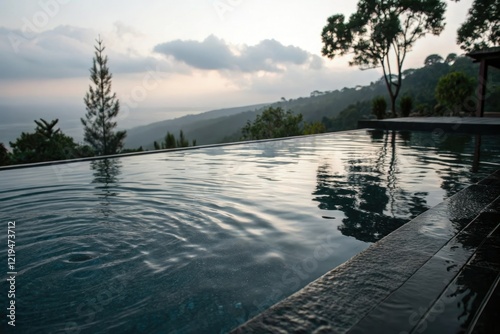 Dark glassy surface of a pool with gentle ripples and subtle water reflections, glassiness, rippled surface, calmness photo