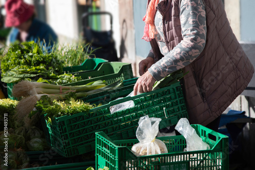 Female farmers selling their vegetables directly at an open-air market