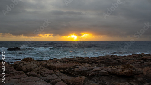 Sunrise over the ocean, located at Orange Rocks in Uvongo in Margate, South Africa