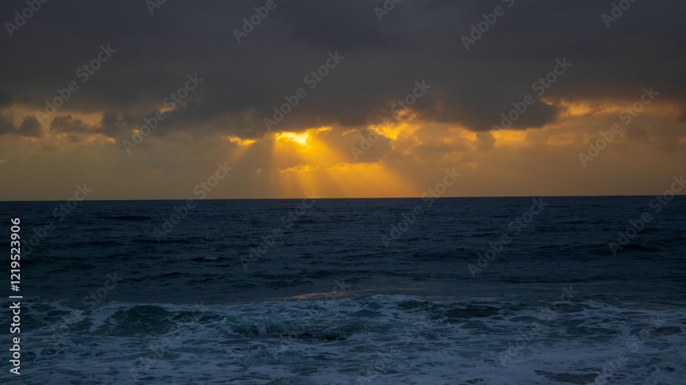 Sunrise over the ocean, located at Orange Rocks in Uvongo in Margate, South Africa Sunrise over the ocean, located at Orange Rocks in Uvongo in Margate, South Africa