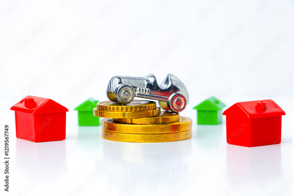 Miniature houses and car sit atop gold coins, representing real estate investment, property value, and financial growth. The image symbolizes market trends, homeownership