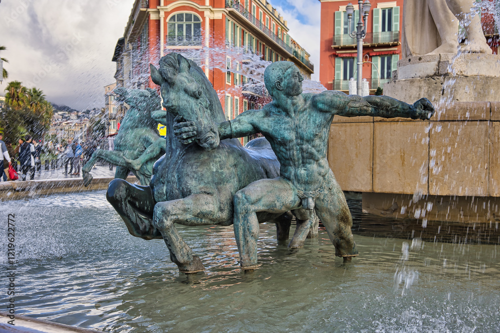Famous Fontaine du Soleil Fountain of the Sun in Place Massena in Nice, France.