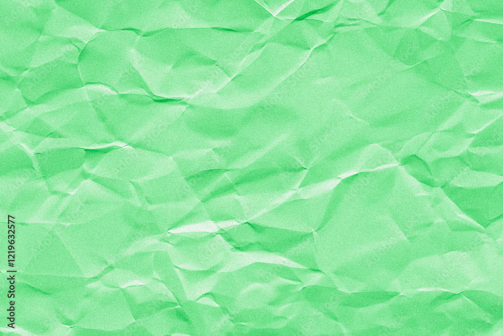 Fototapeta premium Creased or crumpled green colored paper background. Wrinkled blank sheet texture with grain or noise 